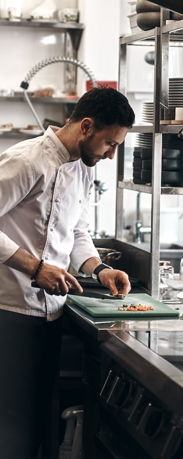 man in white dress shirt holding white ceramic plate